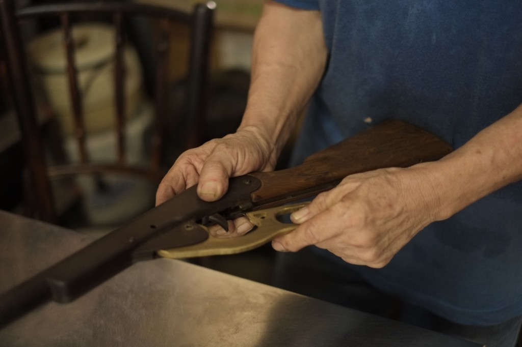 CAN'T STOP WORKING: Jimmy has been working on fixing an old toy gun for quite a while. Even on his day off, he can't stop trying to fix things.