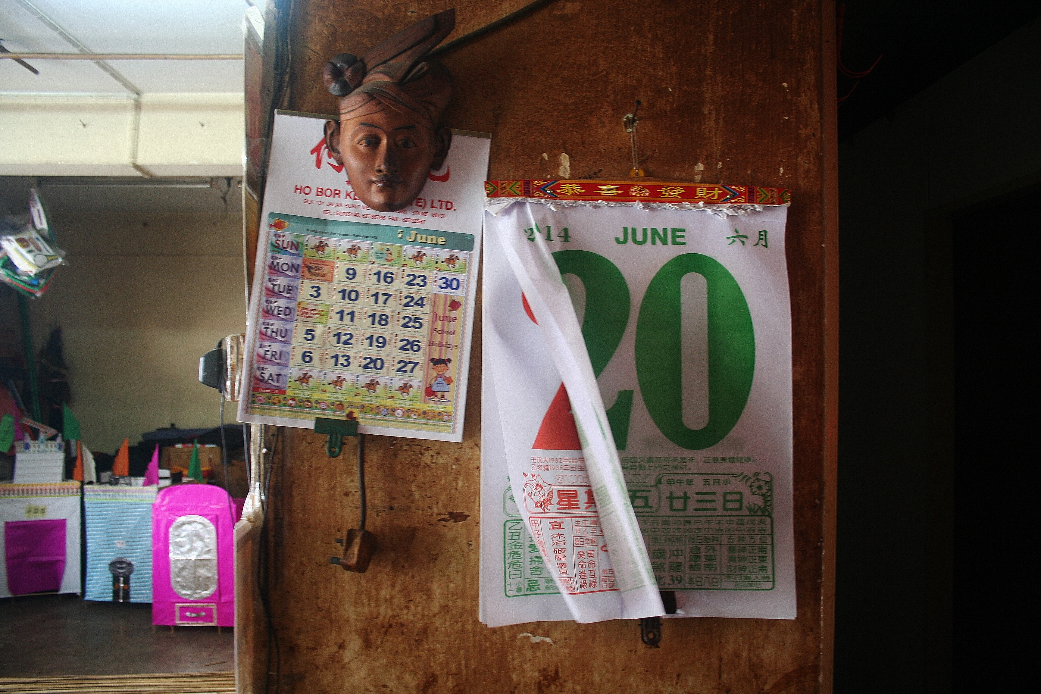 LOPSIDED: Traditional Chinese calendars hang within the shop 