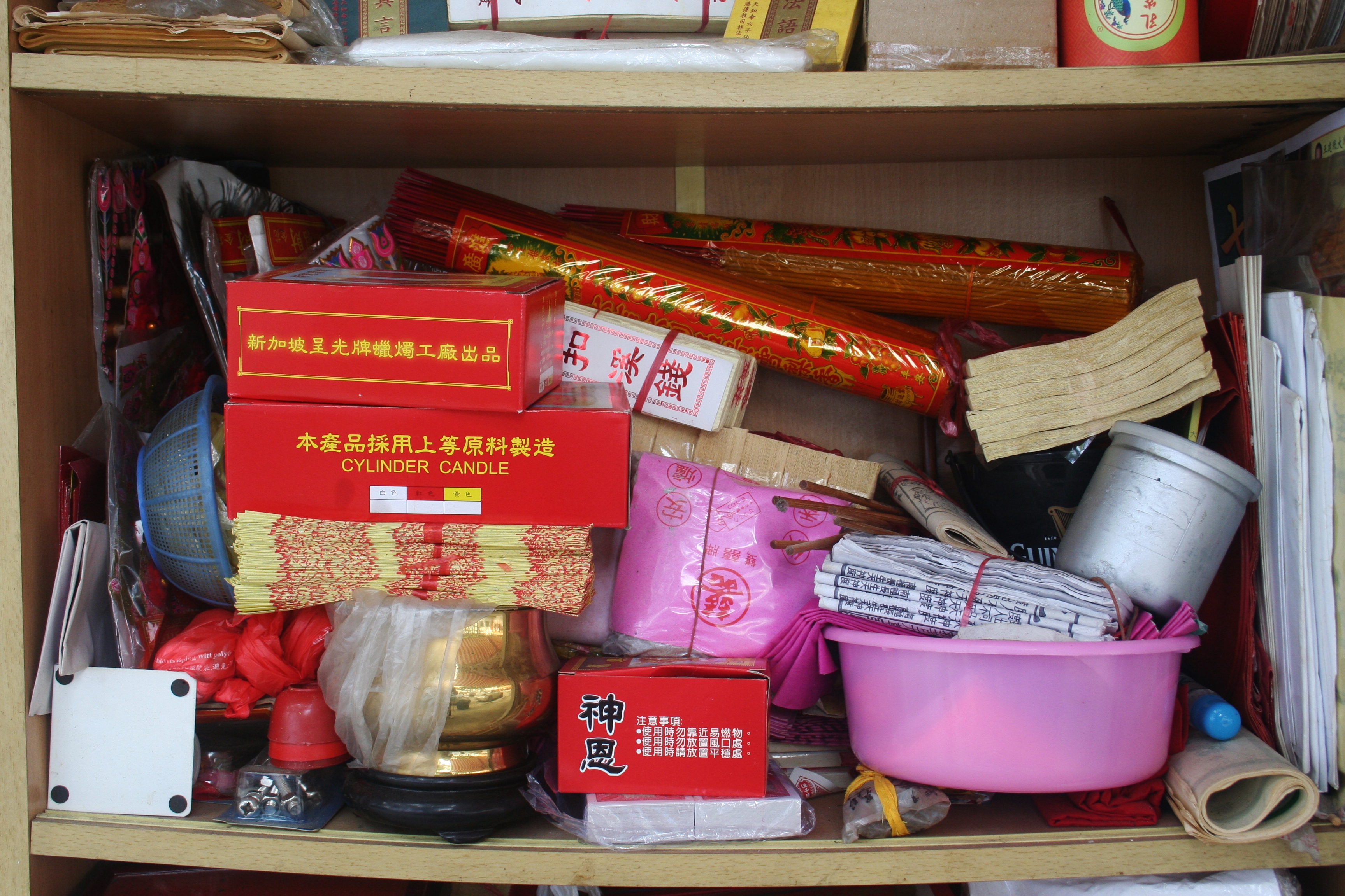 RED: Joss sticks, fake paper money, candle cylinders various other offerings 