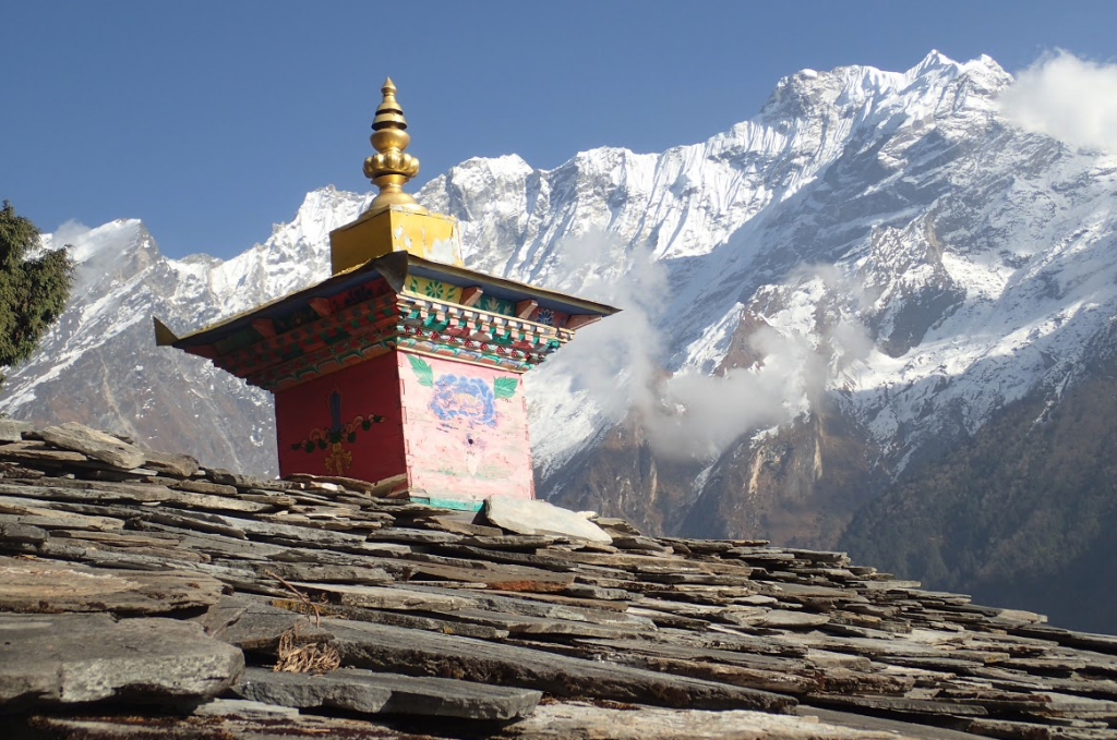 Roof and Tibetan-style chimney on the way to the mountain pass