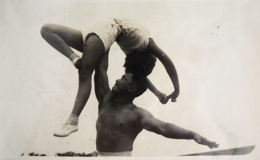 Being lifted by her father, a former Malayan Weight Lifting Champion.