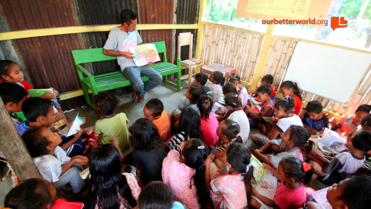 Hosting a library and many young readers in his home.