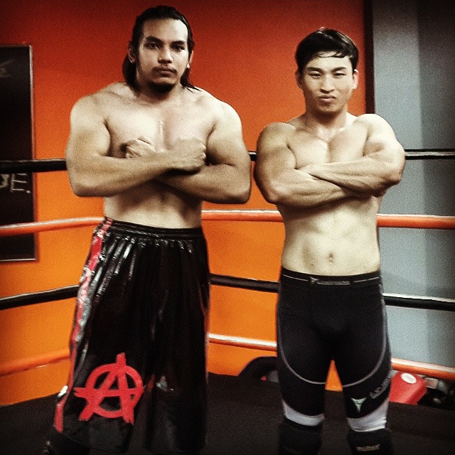 Ayez with the co-founder, assistant trainer and operations director of Singapore Pro Wrestling (SPW), Andruew Tang.