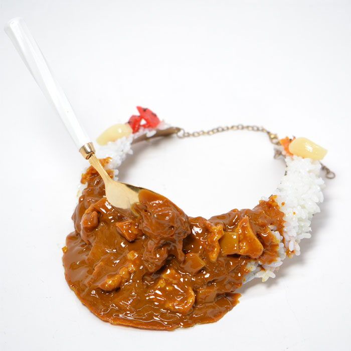 Curry rice with spoon necklace.