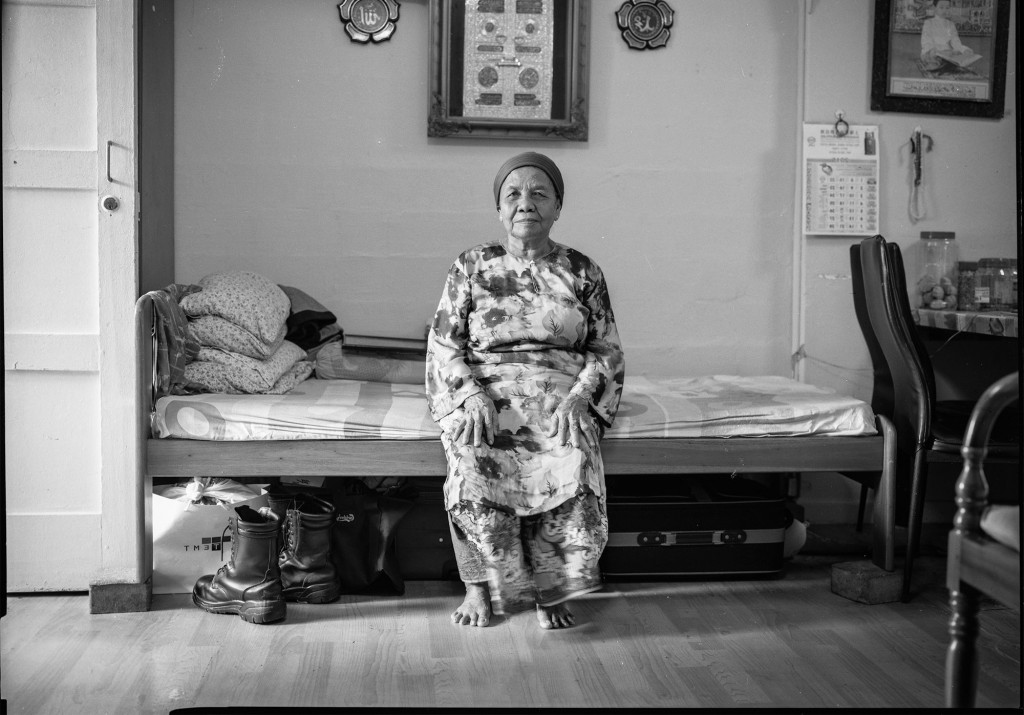 Former Pulau Semakau islander Minah Bte Gap in her one-room flat in Telok Blangah, the same flat she’s been living in since her resettlement in 1977.  