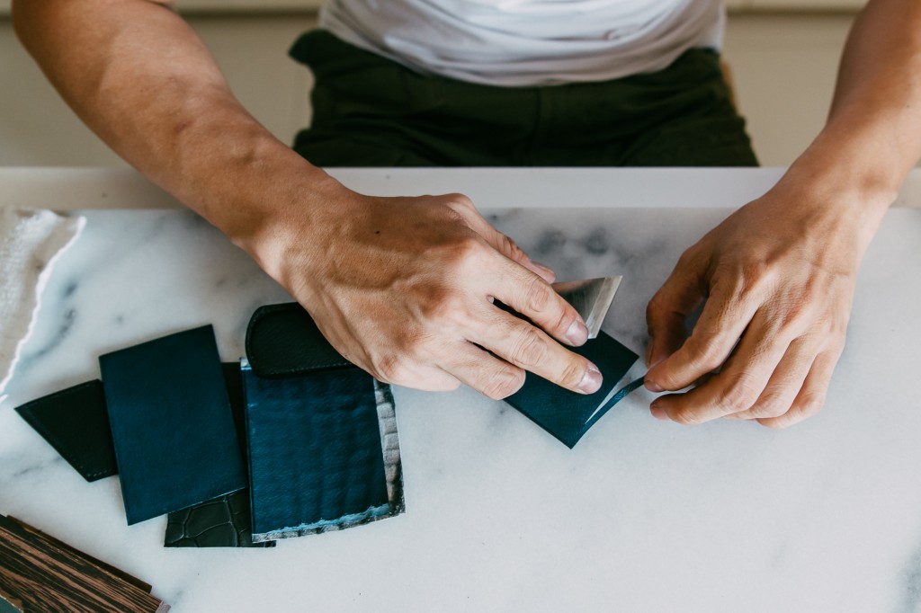 Roy spends an hour sharpening and preparing his tools before each project. Here, Roy hand skives the leather with a very sharp Vergez Blanchard knife