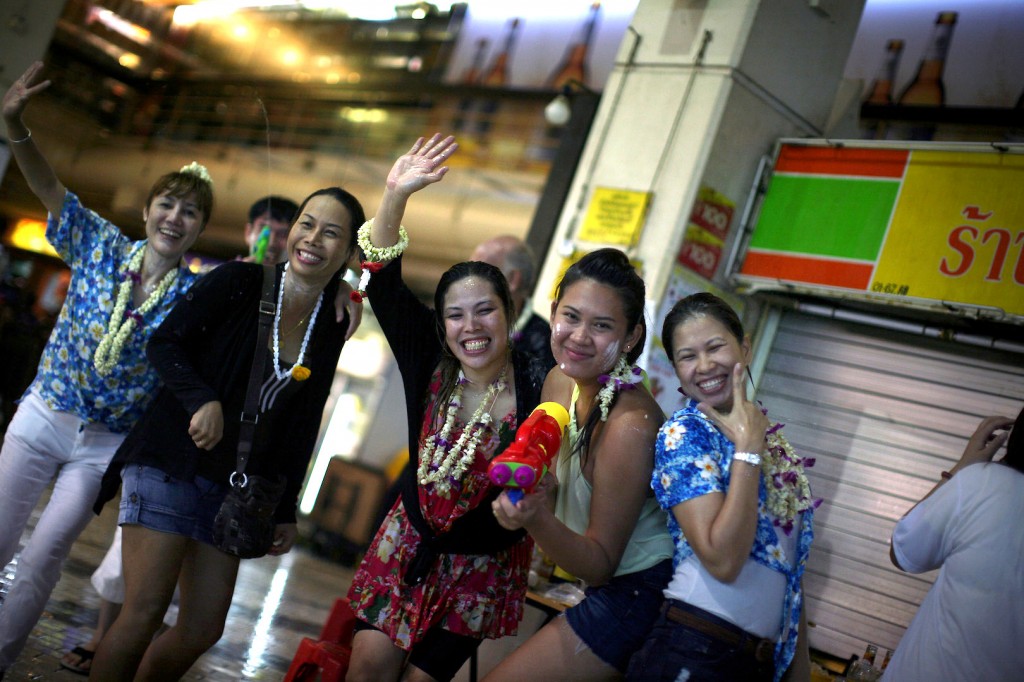 POSE, SHOOT: Armed and very dangerously fun at Singapore's Golden Mile Complex for Songkran 2013. 