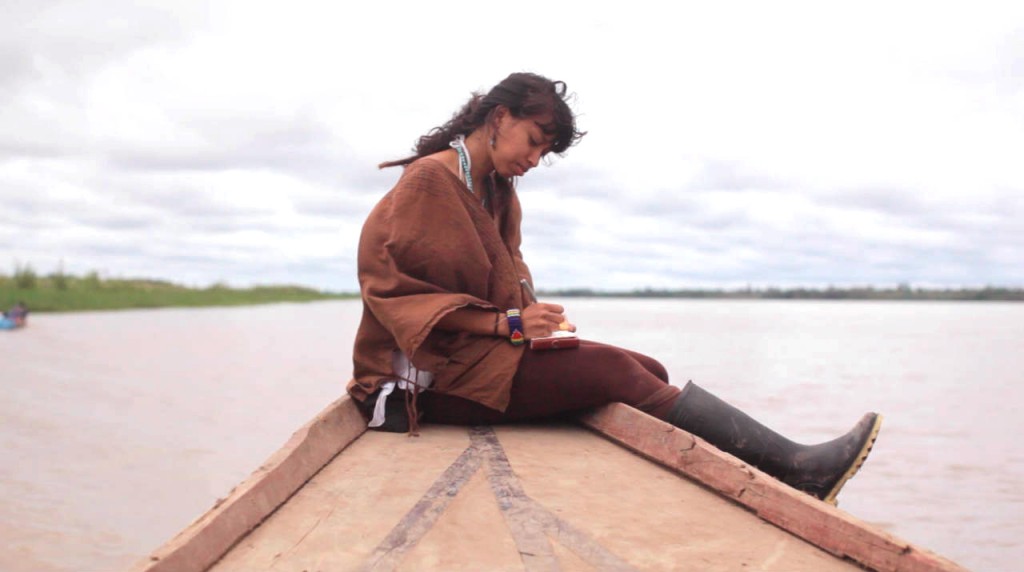 I'M ON A BOAT: Malika on River Ucayali, filming for her documentary, Arkayana: A healing journey into the Amazon.