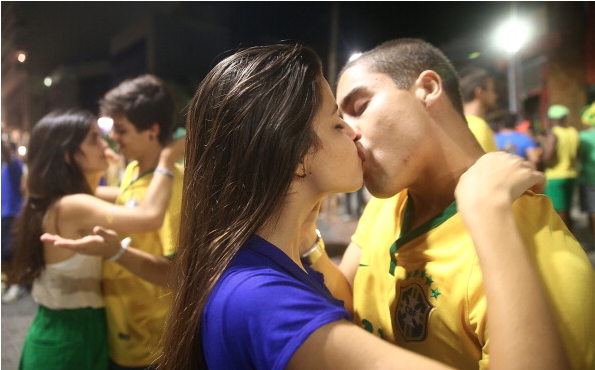 GET A ROOM: Brazil fans kiss after watching the Brazil-Mexico match.